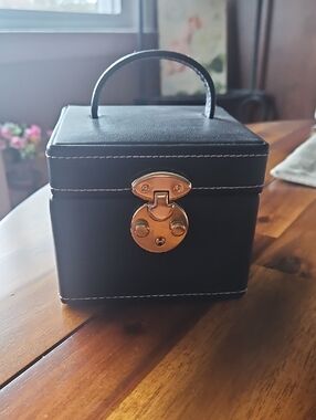 Black Travel Jewelry Case with Gold Hardware and Interior Mirror